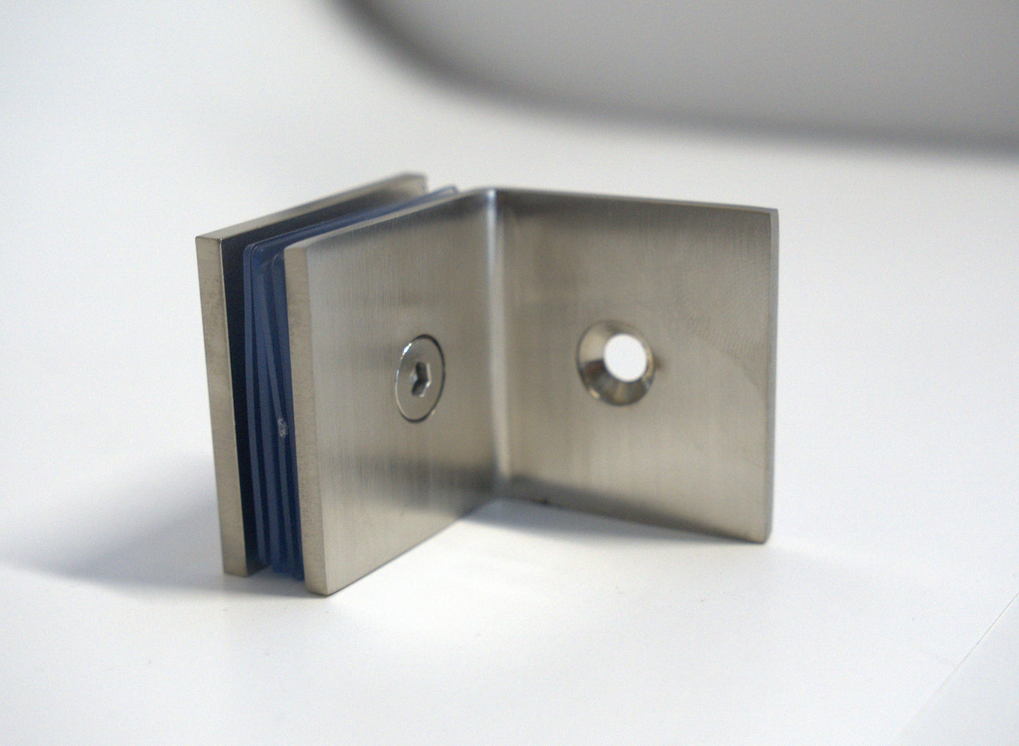 Glass to wall clamp at 90 degrees by Best Glass Parts, showing a sturdy metal bracket securing glass panels at a right angle.