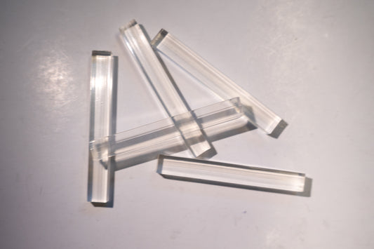 Set of Best Glass Parts setting blocks and shims for glass installation, gray spacer and shim blocks for precise positioning.