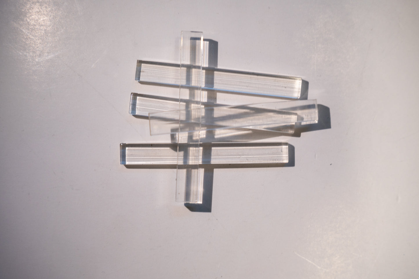 Set of Best Glass Parts setting blocks and shims for glass installation, arranged in a neat row on a white background.