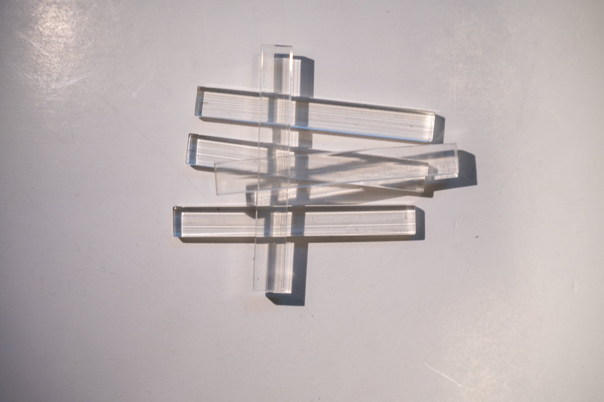 Set of Best Glass Parts setting blocks and shims for glass installation, arranged in a neat row on a white background.