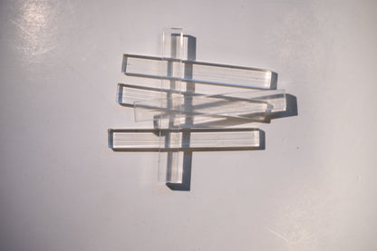 Set of Best Glass Parts setting blocks and shims for glass installation, arranged in a neat row on a white background.