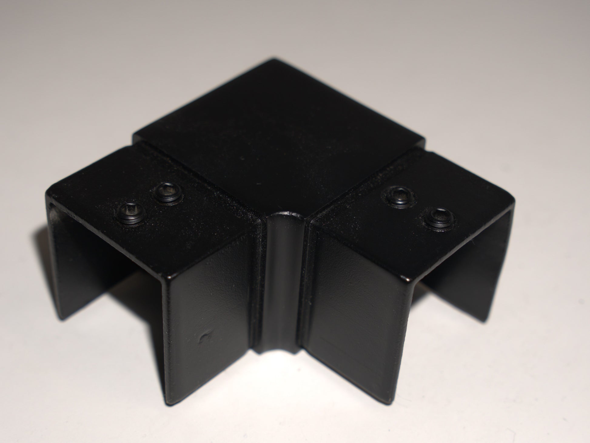 Black square horizontal railing top handrail 90 degree elbow fitting by Best Glass Parts, suitable for glass railing systems.