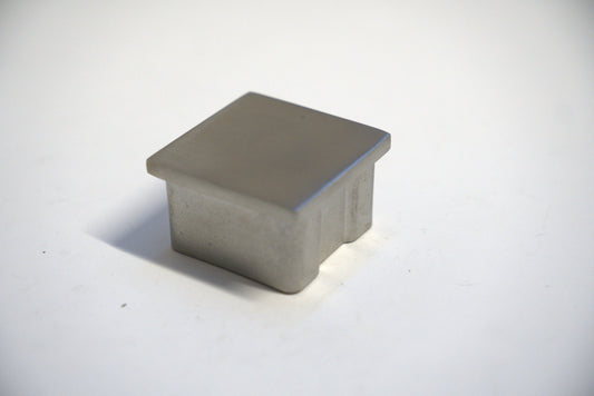 Square handrail end cap for railing top, designed by Best Glass Parts, shown in a sleek, silver finish.