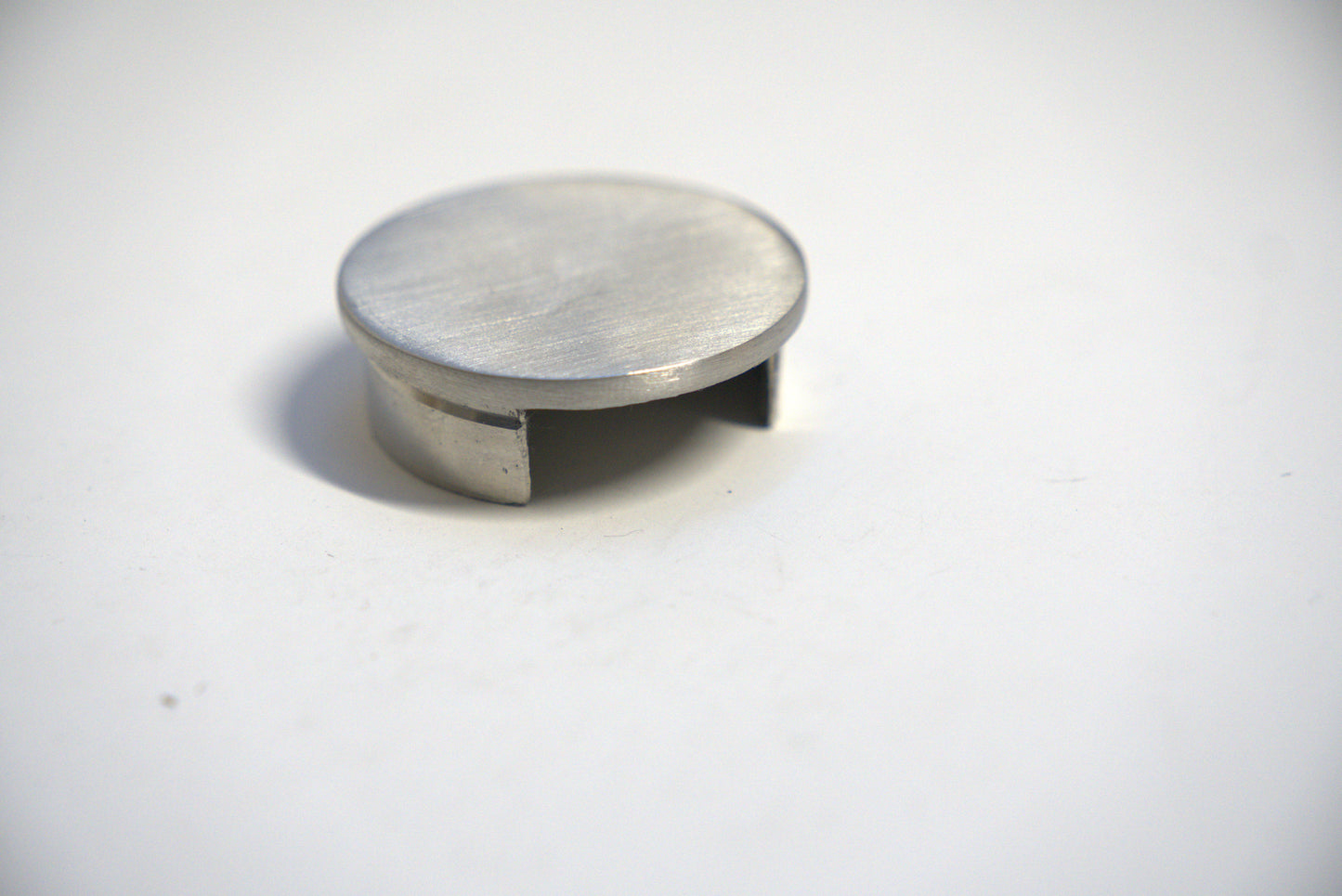 Round end cap for top handrail, designed for glass railings, by Best Glass Parts, showcasing a sleek, polished finish.