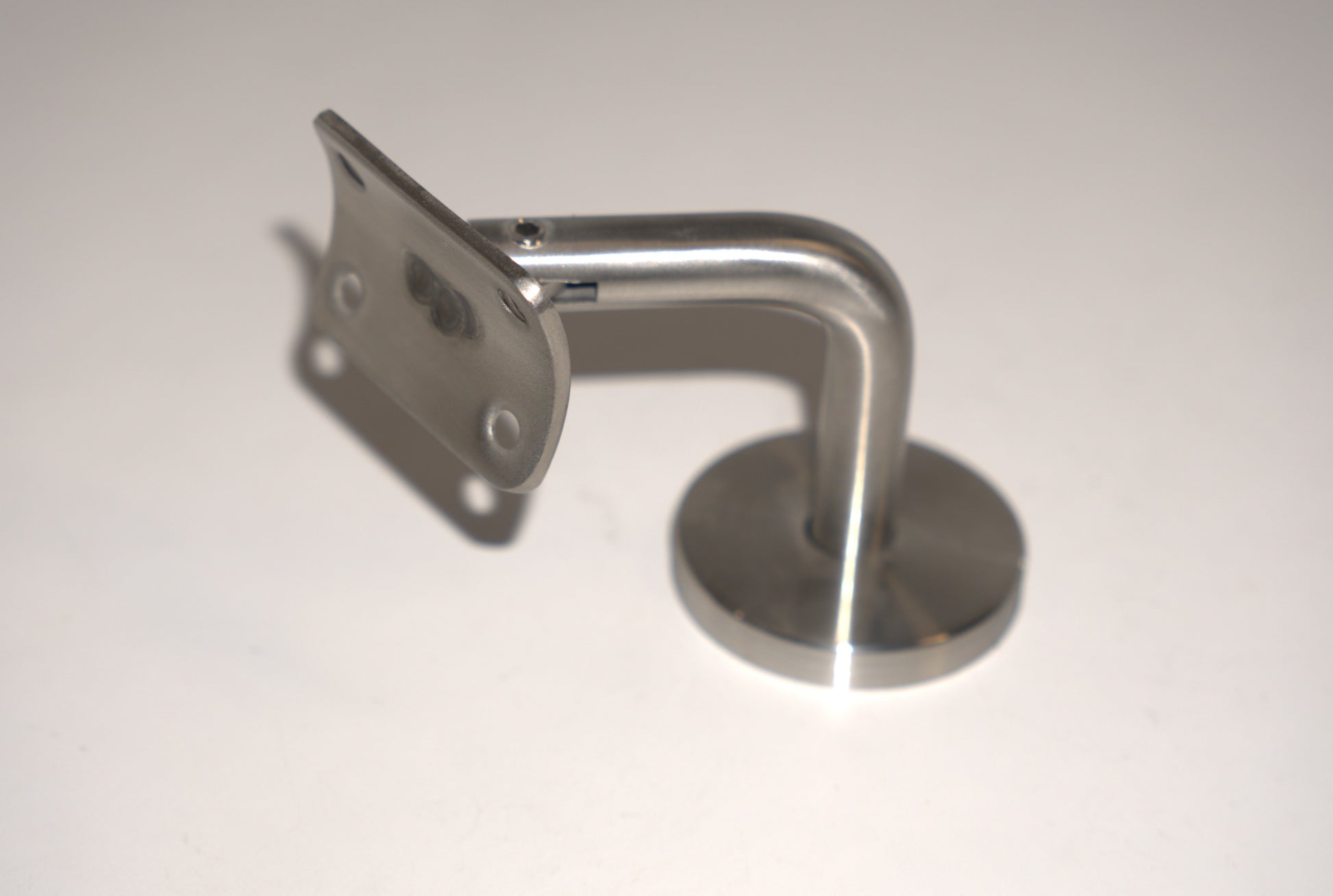 Round wall to handrail bracket by Best Glass Parts, showing a sturdy metal support for glass railings.