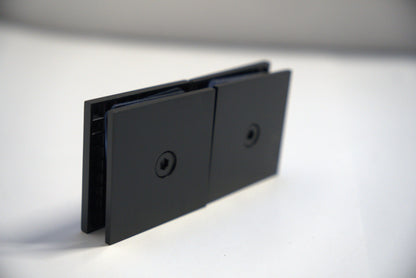 Chrome glass-to-glass clamp 180 transom by Best Glass Parts, used for securing glass panels in shower enclosures.