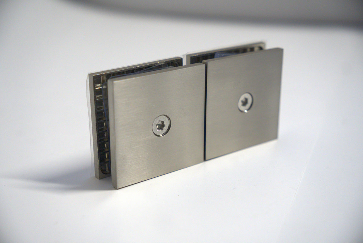 Chrome glass to glass clamp 180 transom by Best Glass Parts, used for securing glass panels in shower enclosures.