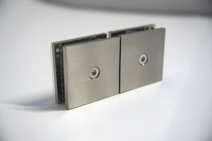 Chrome glass to glass clamp 180 transom by Best Glass Parts, used for securing glass panels in shower enclosures.