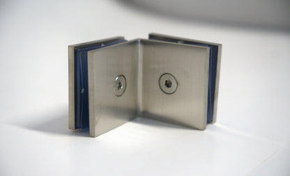 Glass to glass clamp 90 from Best Glass Parts, showing a sturdy metal clamp used for securing glass panels in installations.