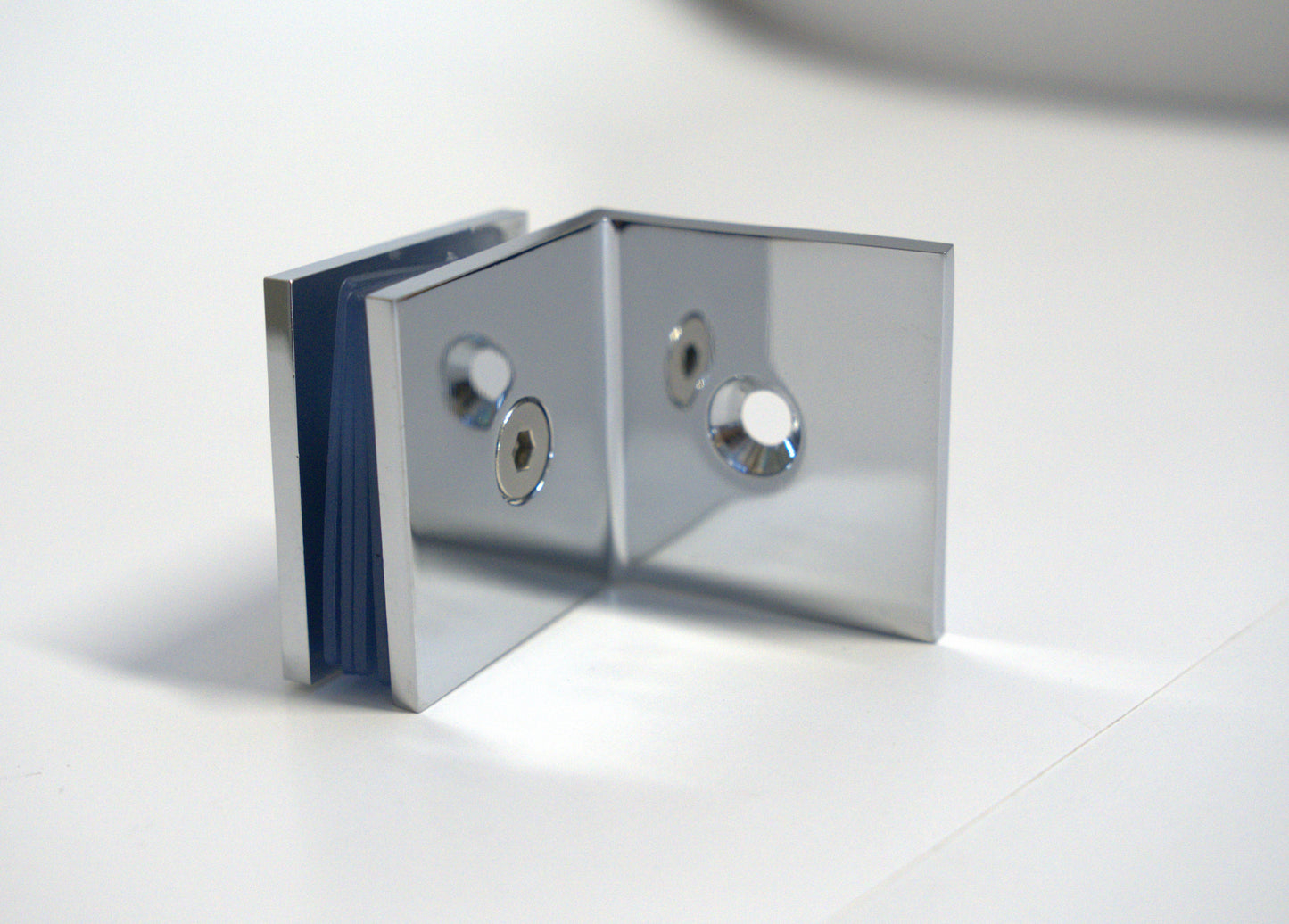 Glass to wall clamp at 90 degrees by Best Glass Parts, showing a clear metal fitting for securing glass panels.