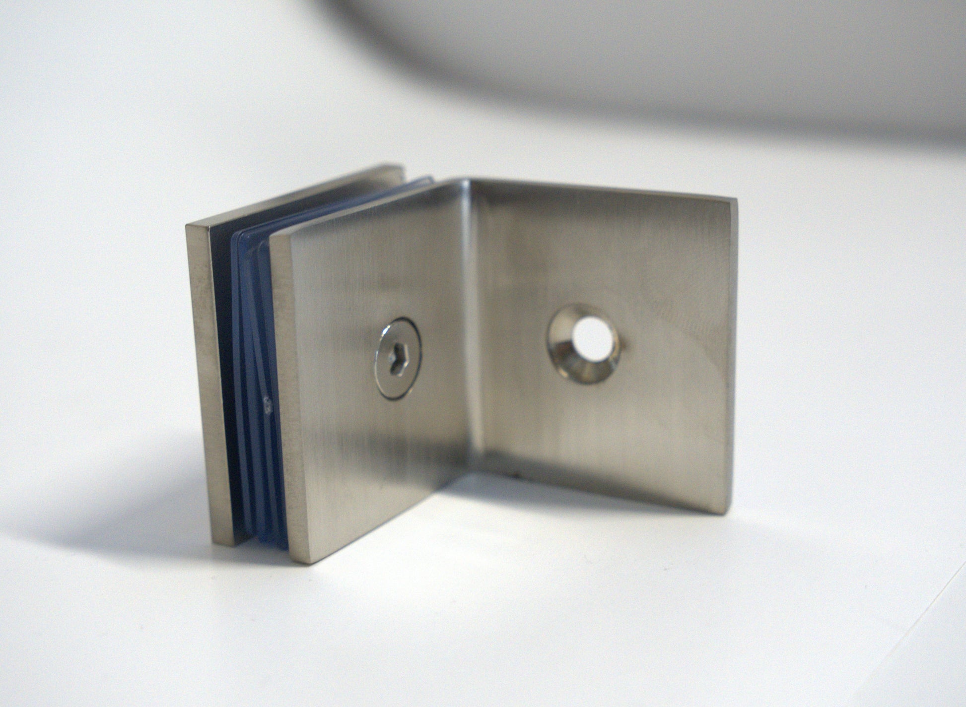 Glass to wall clamp at 90 degrees by Best Glass Parts, showing a sturdy metal bracket securing glass panels at a right angle.