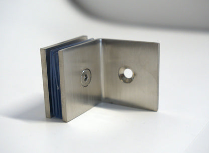 Glass to wall clamp at 90 degrees by Best Glass Parts, showing a sturdy metal bracket securing glass panels at a right angle.