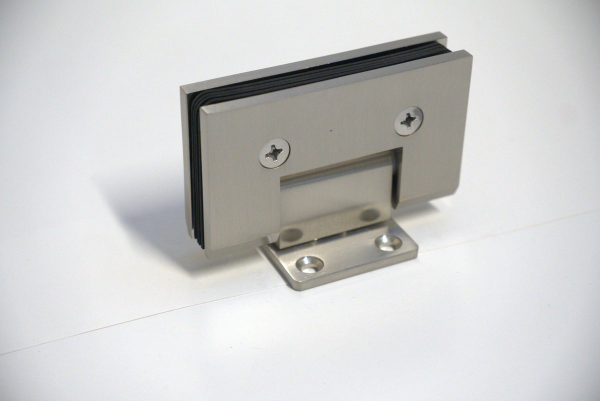Heavy-duty VEN wall-to-glass hinge with S plate by Best Glass Parts, shown in a close-up of the durable metal hinge for glass doors.