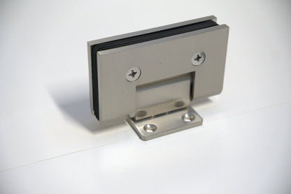 Heavy-duty VEN wall-to-glass hinge with S plate by Best Glass Parts, shown in a close-up of the durable metal hinge for glass doors.