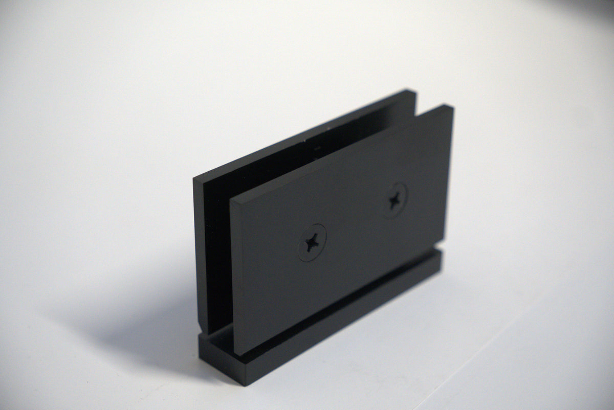 Geneva hinge pivot for glass doors, top and bottom, with curved design, by Best Glass Parts, mounted on clear glass.