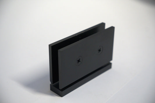 Geneva hinge pivot for glass doors, top and bottom, with curved design, by Best Glass Parts, mounted on clear glass.