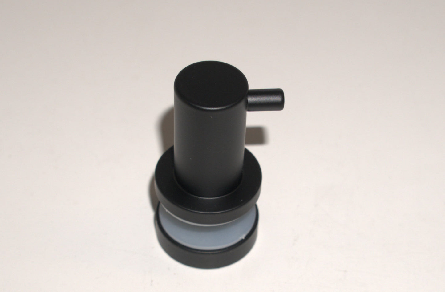 Best Glass Parts knob robe hook mounted on a wall, showing its sleek metal design for bathroom or closet organization.