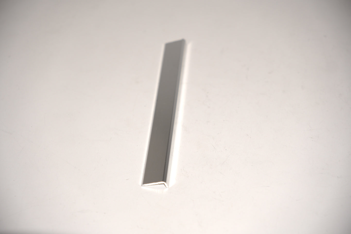 Long 144-inch mirror trim from Best Glass Parts, 3/4 inch wide, shown in this image with a sleek, reflective surface.