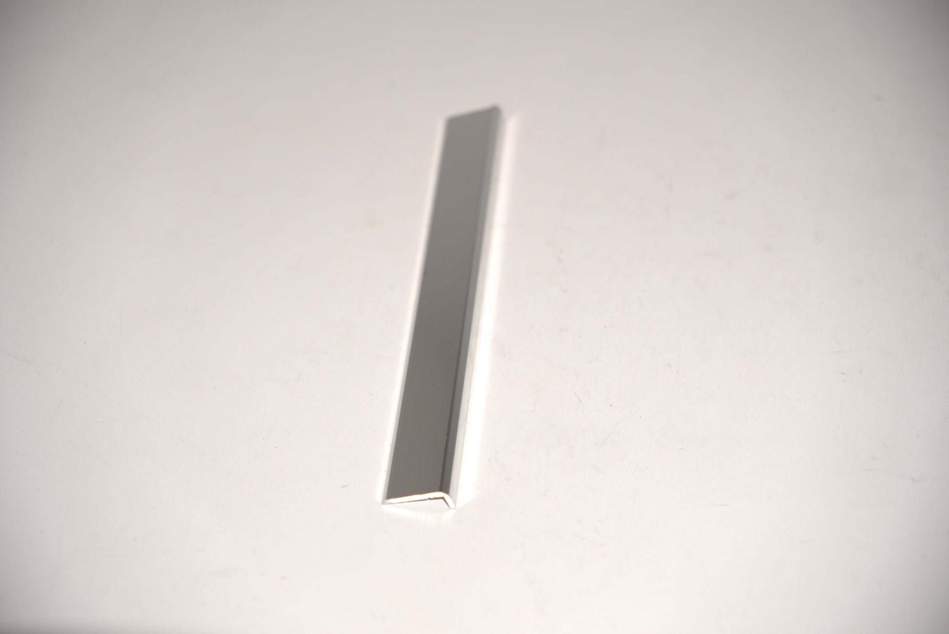 Long 144-inch mirror trim from Best Glass Parts, 3/4 inch wide, shown in this image with a sleek, reflective surface.