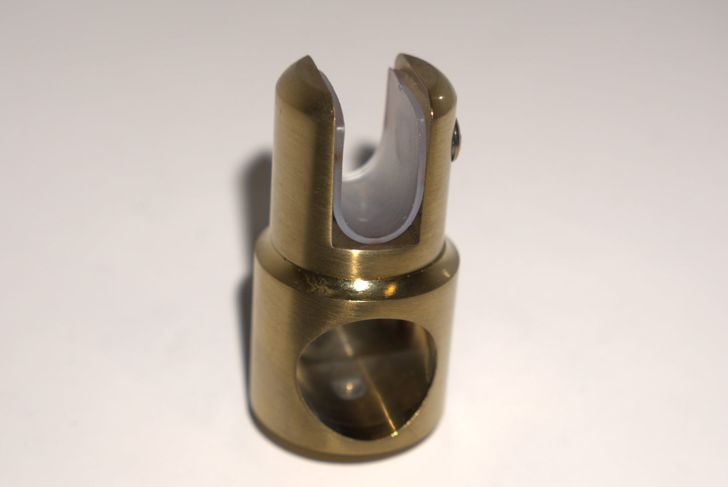 Support bar clamp for glass to rod, half-open design, by Best Glass Parts, shown holding glass securely to a metal rod.