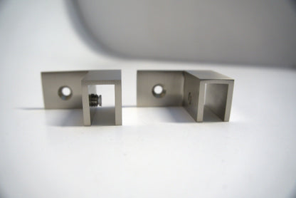 Left-facing Top Clamp 90 from Best Glass Parts, showcasing its durable metal construction and mounting features.