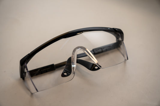 Clear safety glasses from Best Glass Parts with protective lenses, ideal for industrial or laboratory safety.