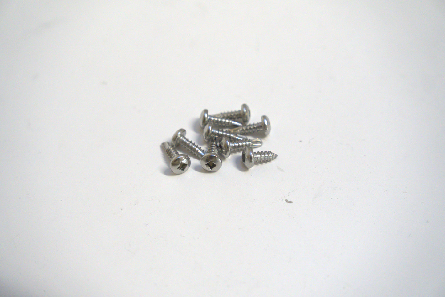 Sheet metal screw 1/2 inch from Best Glass Parts, showing the screw's threaded metal body and sharp point for metal fastening.
