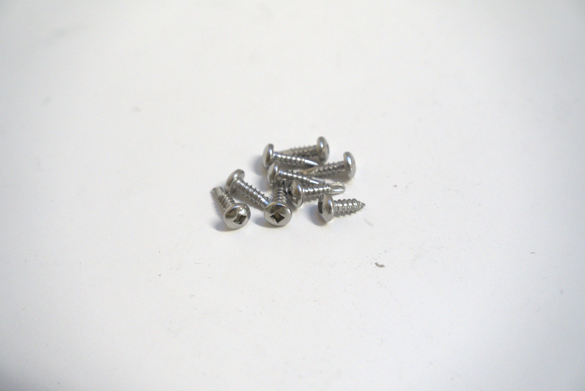 Sheet metal screw 1/2 inch from Best Glass Parts, showing the screw's threaded metal body and sharp point for metal fastening.