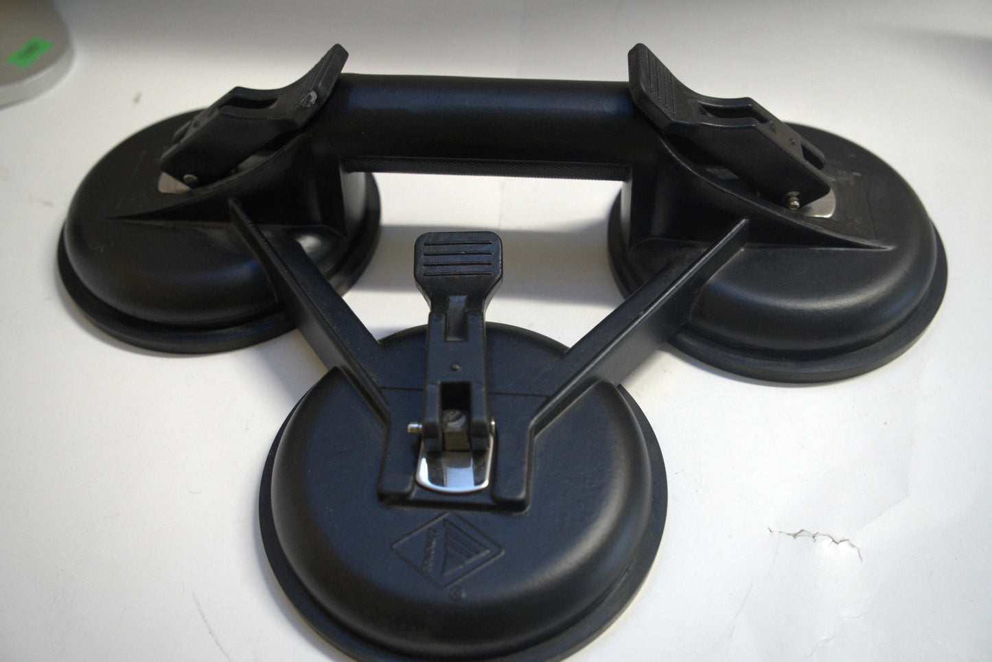 Black suction cup triple plate from Best Glass Parts with three suction cups and a sturdy black frame, ideal for glass mounting.