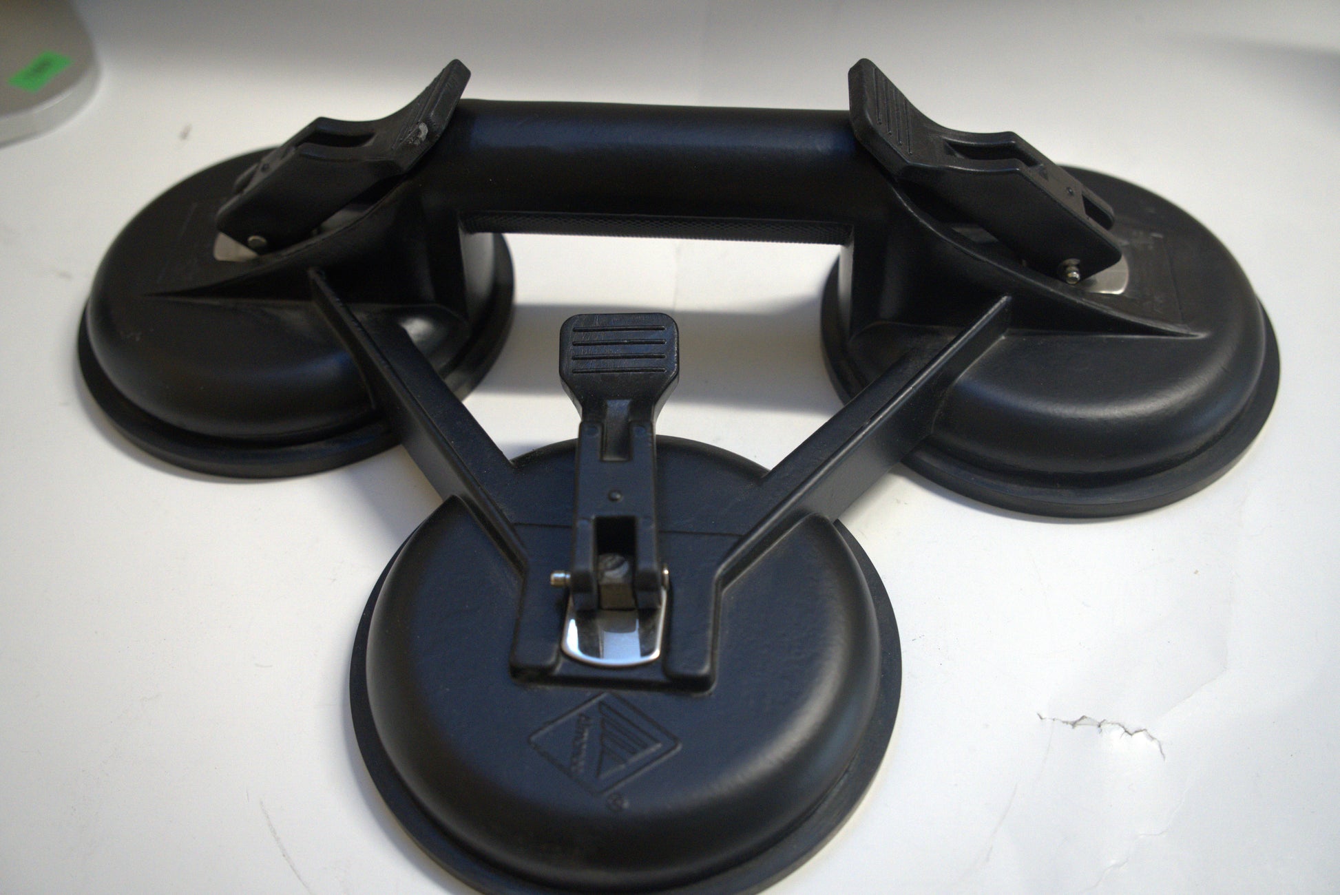 Black suction cup triple plate from Best Glass Parts with three suction cups and a sturdy black frame, ideal for glass mounting.