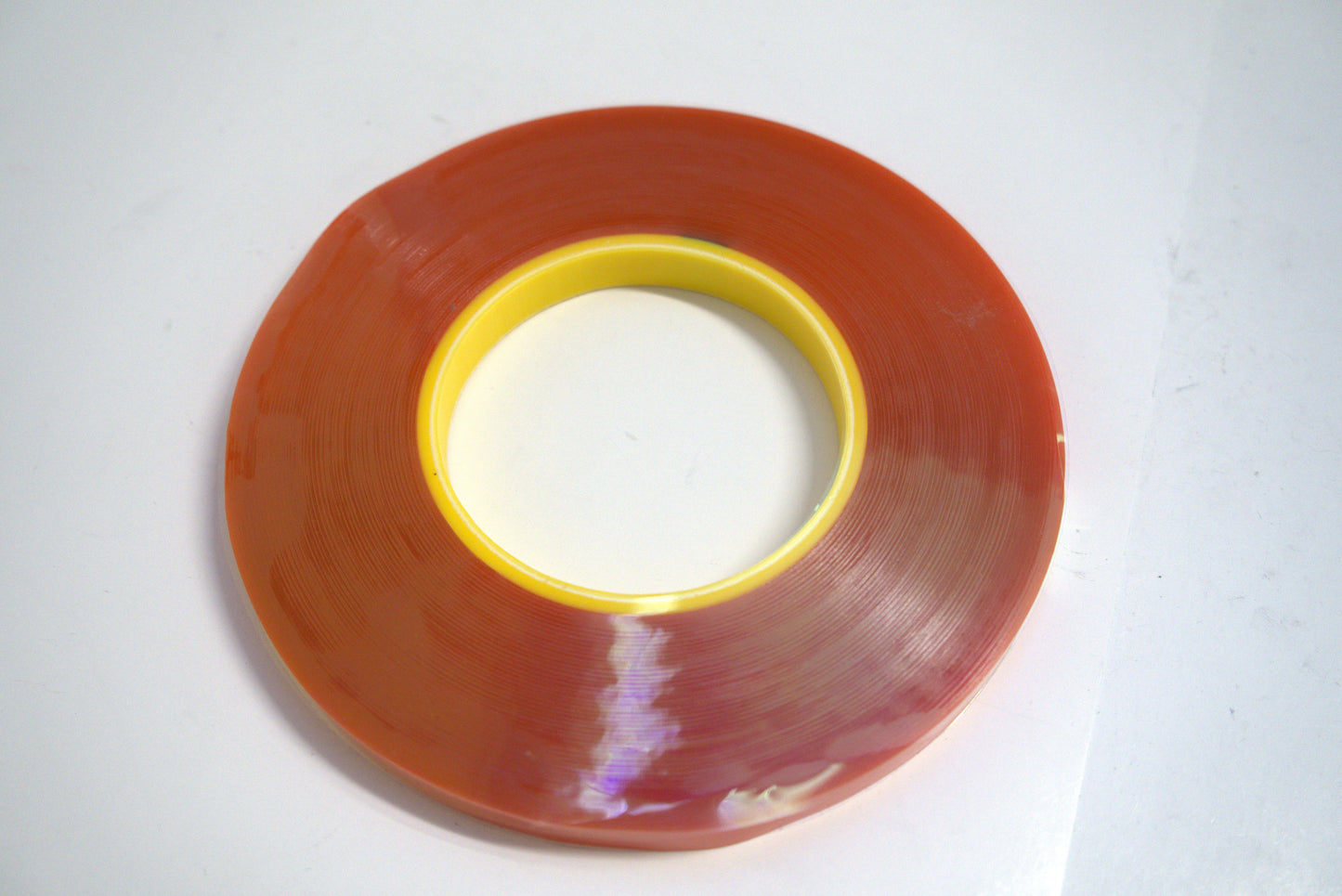Double-sided clear tape from Trim Tessa by Best Glass Parts, showing the transparent adhesive strip on a plain background.