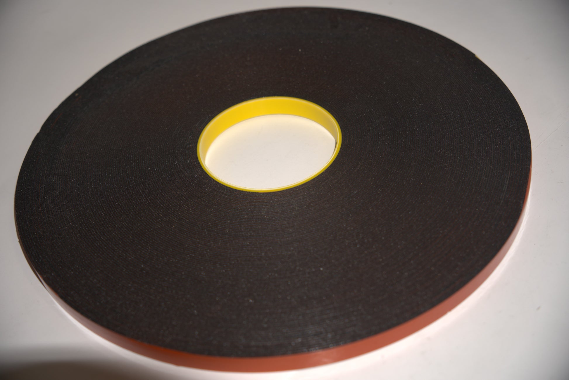 White U-channel tape from Best Glass Parts, showing close-up of flexible adhesive-backed glass edging strip.