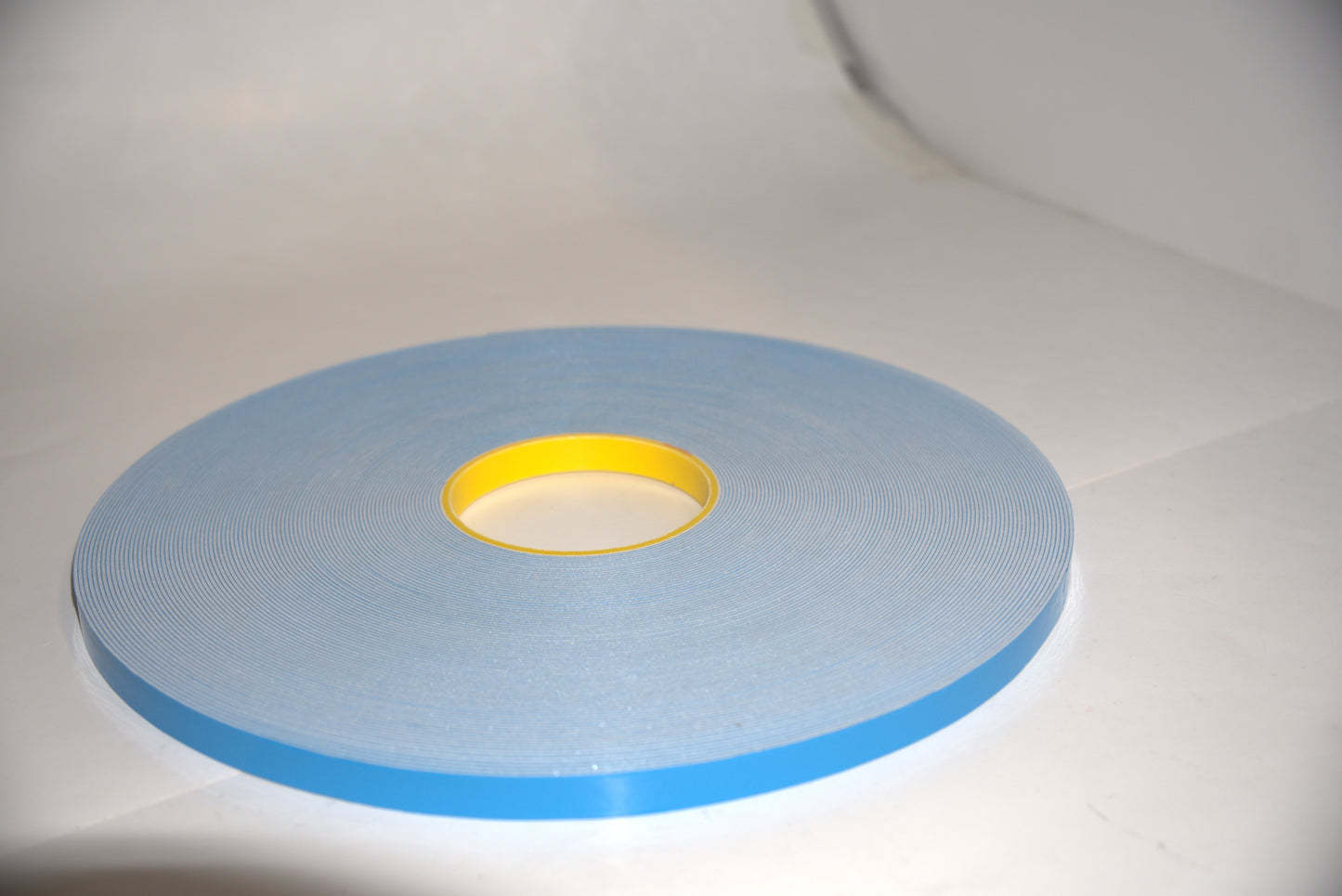 White U-channel tape from Best Glass Parts, close-up showing flexible plastic strip for glass edge protection and sealing.